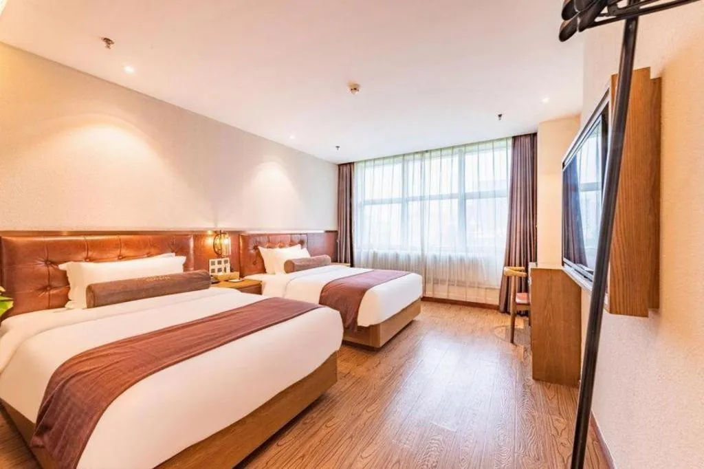 Bed in James Joyce Coffetel Shijiazhuang the Mixc Jinyuan Tower Airport Bus