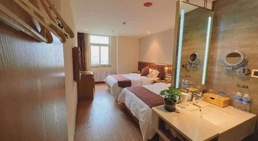 Bed in James Joyce Coffetel Shijiazhuang the Mixc Jinyuan Tower Airport Bus