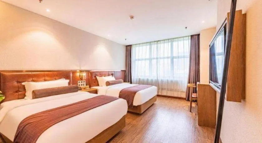 Bed in James Joyce Coffetel Shijiazhuang the Mixc Jinyuan Tower Airport Bus
