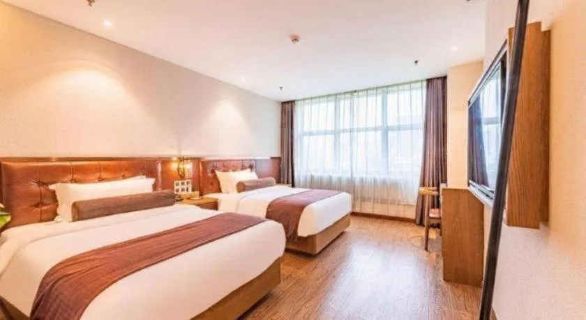 Bed in James Joyce Coffetel Shijiazhuang the Mixc Jinyuan Tower Airport Bus