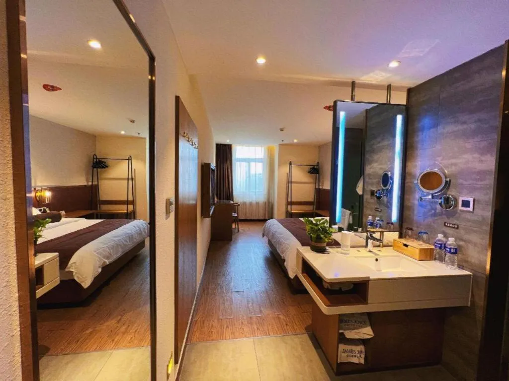 Bed in James Joyce Coffetel Shijiazhuang the Mixc Jinyuan Tower Airport Bus