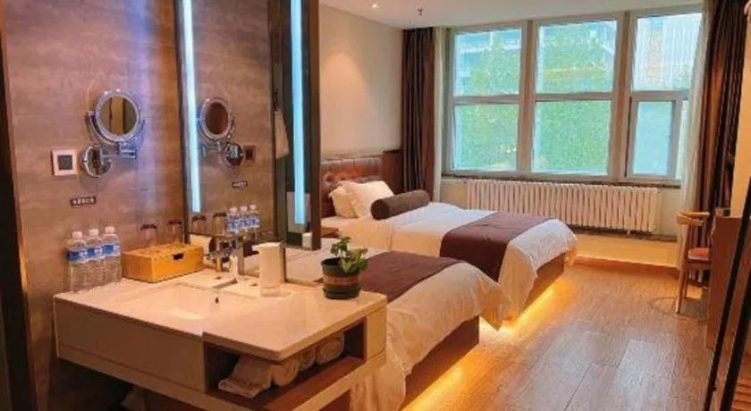 Bed in James Joyce Coffetel Shijiazhuang the Mixc Jinyuan Tower Airport Bus
