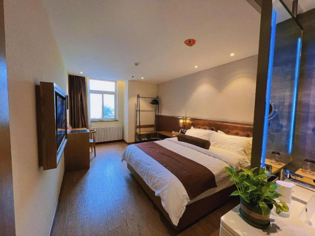 Bed in James Joyce Coffetel Shijiazhuang the Mixc Jinyuan Tower Airport Bus