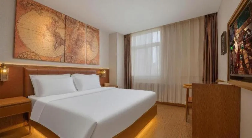 Bed in James Joyce Coffetel Shijiazhuang the Mixc Jinyuan Tower Airport Bus