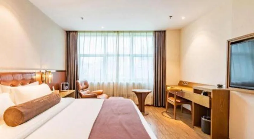 Bed in James Joyce Coffetel Shijiazhuang the Mixc Jinyuan Tower Airport Bus