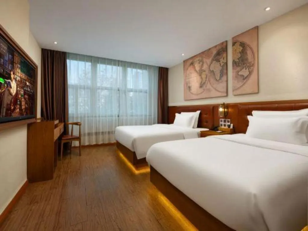 Bed in James Joyce Coffetel Shijiazhuang the Mixc Jinyuan Tower Airport Bus