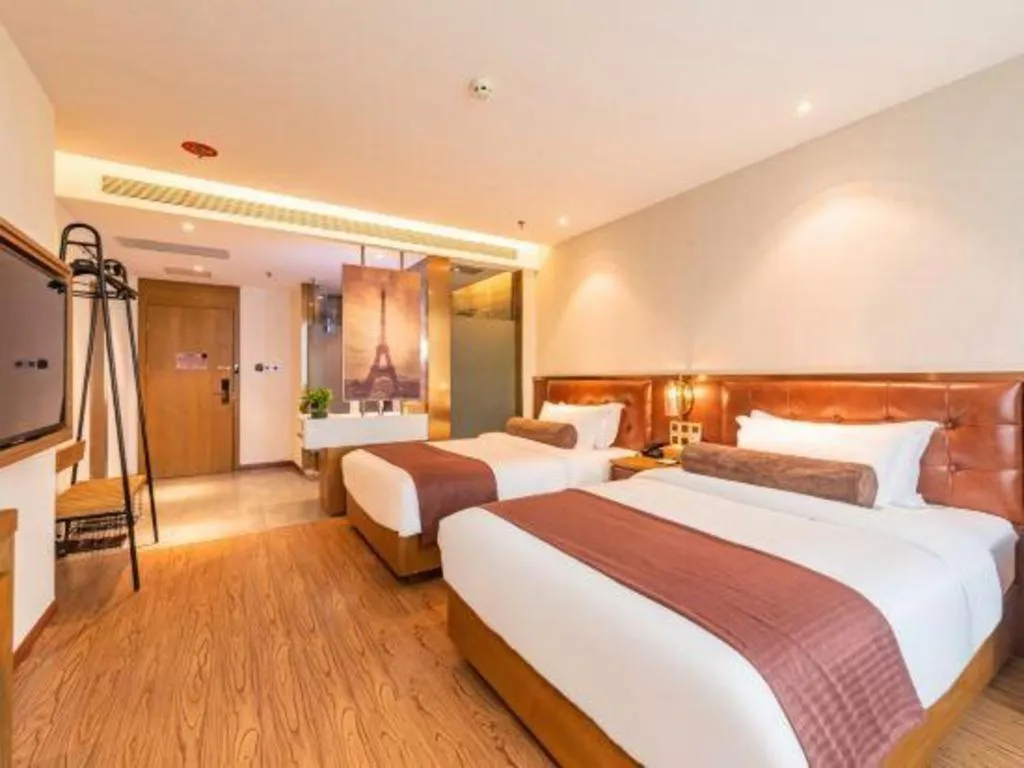 Bed in James Joyce Coffetel Shijiazhuang the Mixc Jinyuan Tower Airport Bus