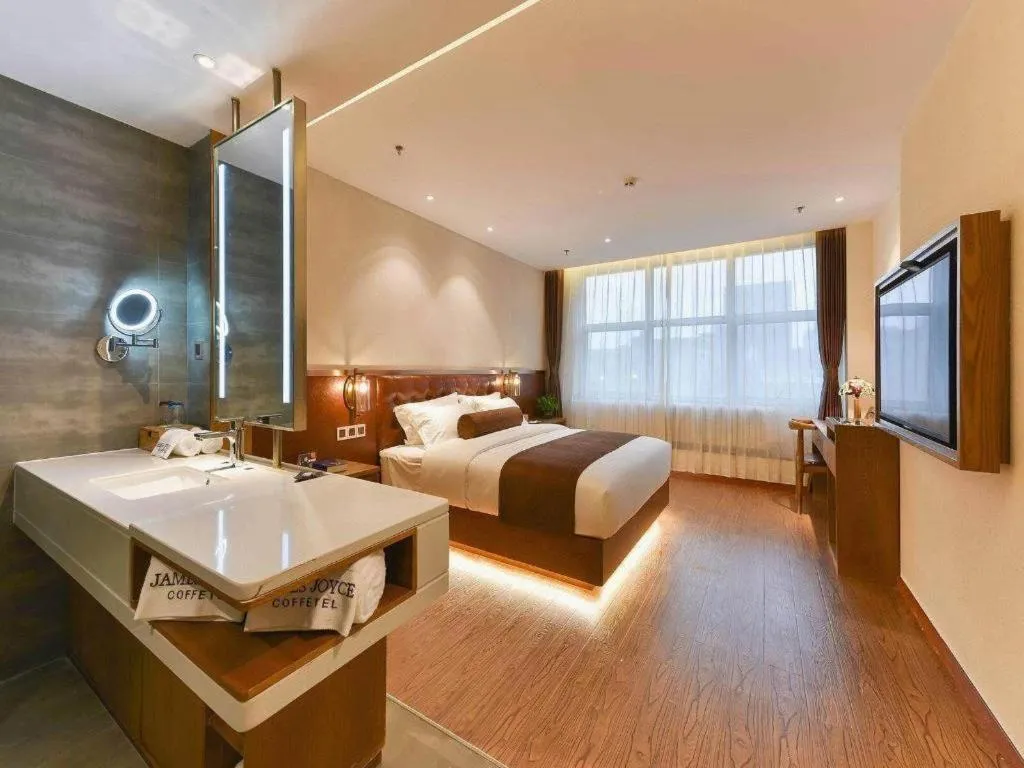 Bed in James Joyce Coffetel Shijiazhuang the Mixc Jinyuan Tower Airport Bus