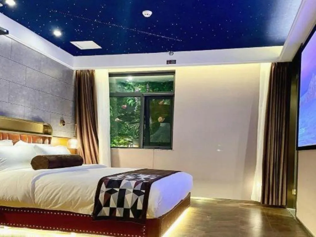 Bed in James Joyce Coffetel Shijiazhuang the Mixc Jinyuan Tower Airport Bus