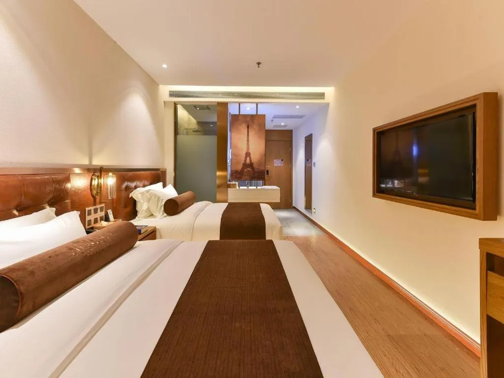 Bed in James Joyce Coffetel Shijiazhuang the Mixc Jinyuan Tower Airport Bus