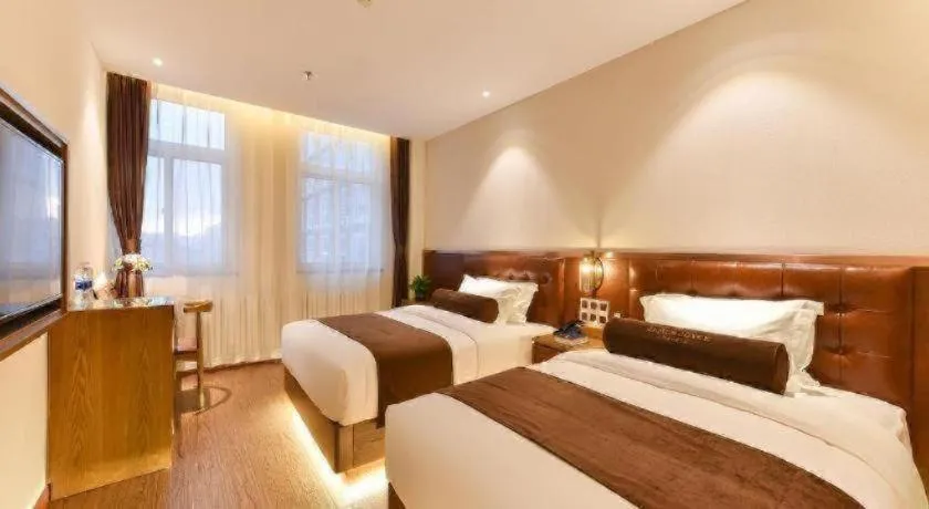 Bed in James Joyce Coffetel Shijiazhuang the Mixc Jinyuan Tower Airport Bus