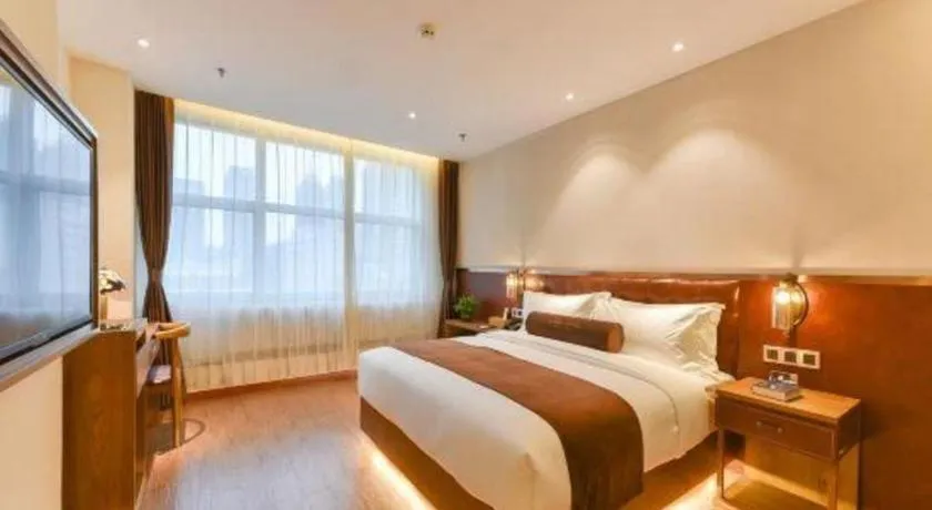Bed in James Joyce Coffetel Shijiazhuang the Mixc Jinyuan Tower Airport Bus
