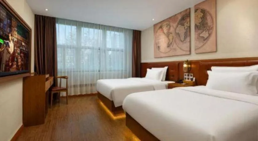 Bed in James Joyce Coffetel Shijiazhuang the Mixc Jinyuan Tower Airport Bus