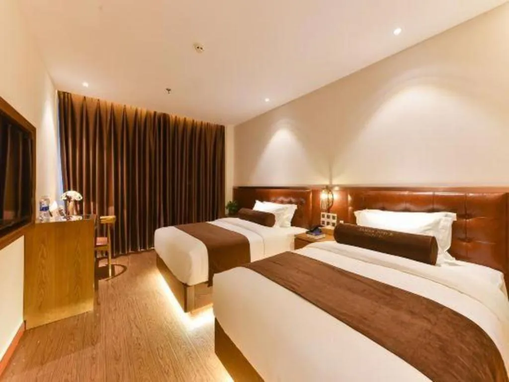 Bed in James Joyce Coffetel Shijiazhuang the Mixc Jinyuan Tower Airport Bus