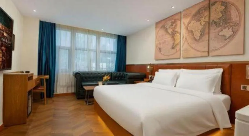 Bed in James Joyce Coffetel Shijiazhuang the Mixc Jinyuan Tower Airport Bus