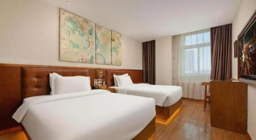Bed in James Joyce Coffetel Shijiazhuang the Mixc Jinyuan Tower Airport Bus