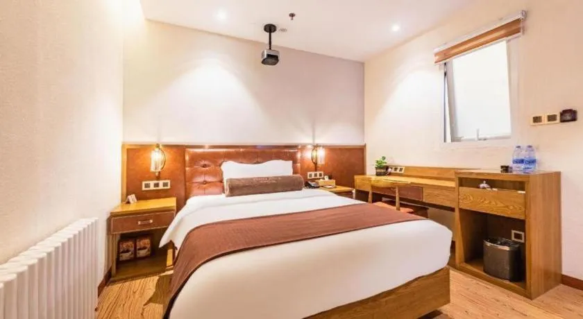 Bed in James Joyce Coffetel Shijiazhuang the Mixc Jinyuan Tower Airport Bus
