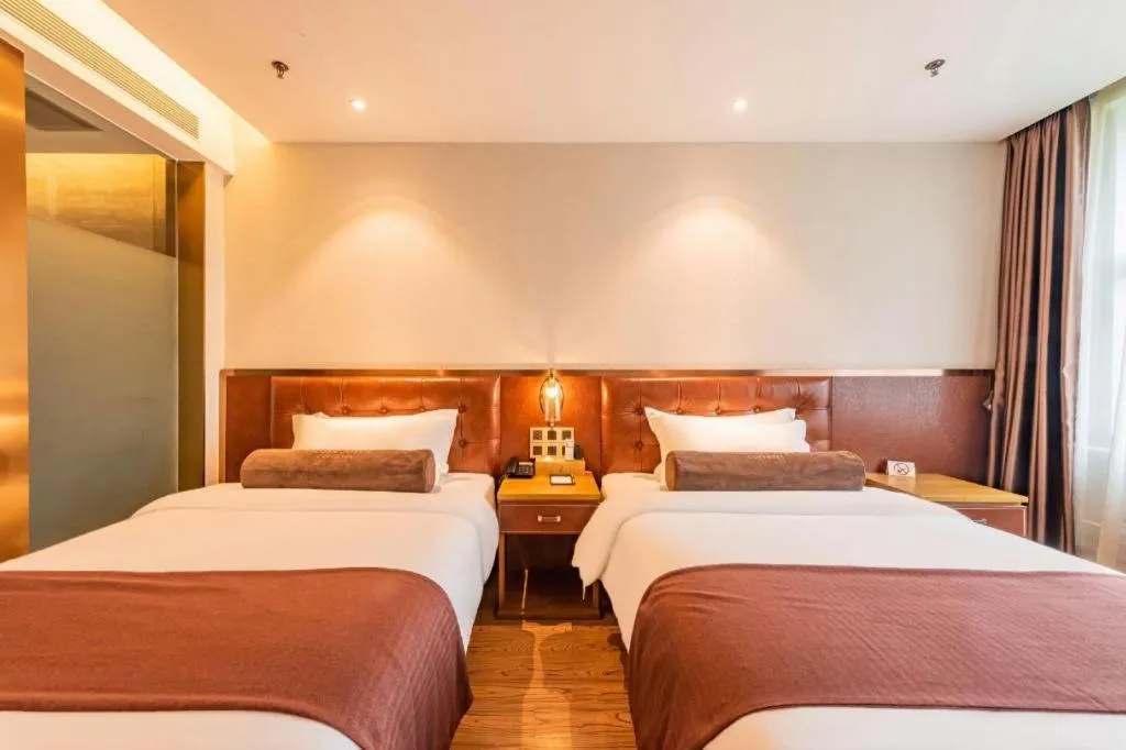 Bed in James Joyce Coffetel Shijiazhuang the Mixc Jinyuan Tower Airport Bus