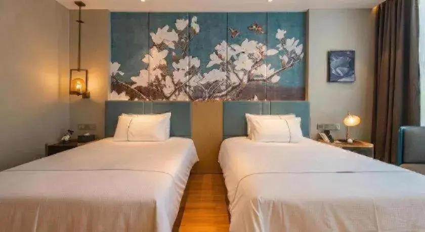 Bed in Magnotel Tongxiang Shimao Center Bed in Magnotel Tongxiang Shimao Center