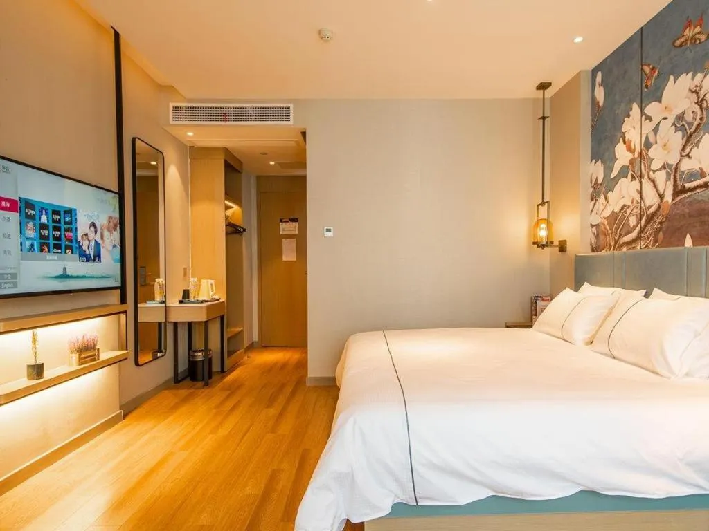 Bed in Magnotel Tongxiang Shimao Center