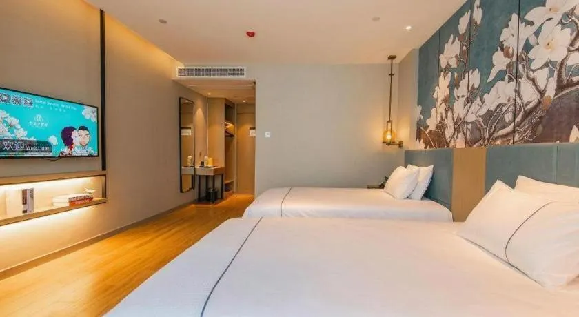 Bed in Magnotel Tongxiang Shimao Center