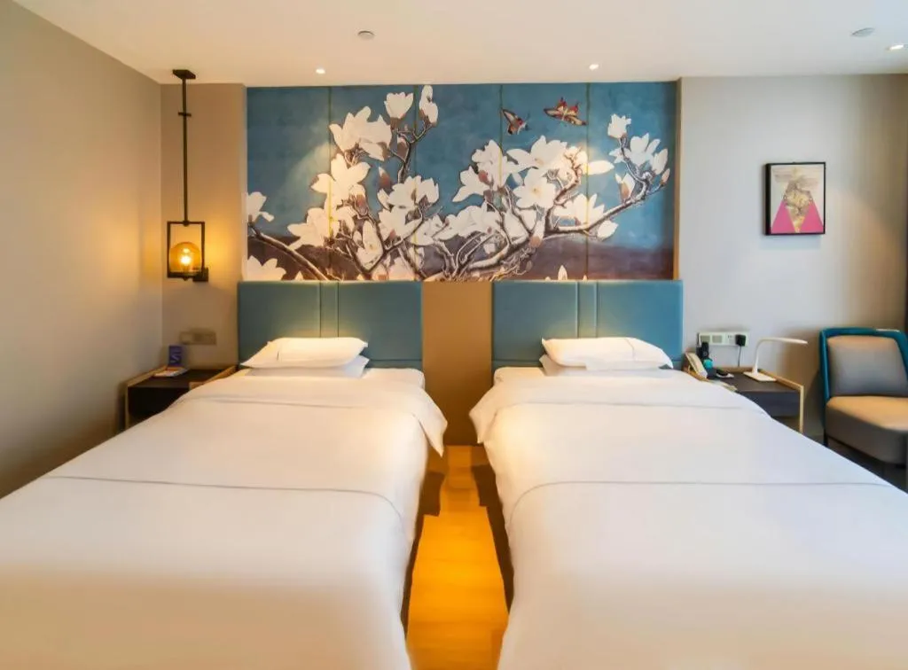 Bed in Magnotel Tongxiang Shimao Center