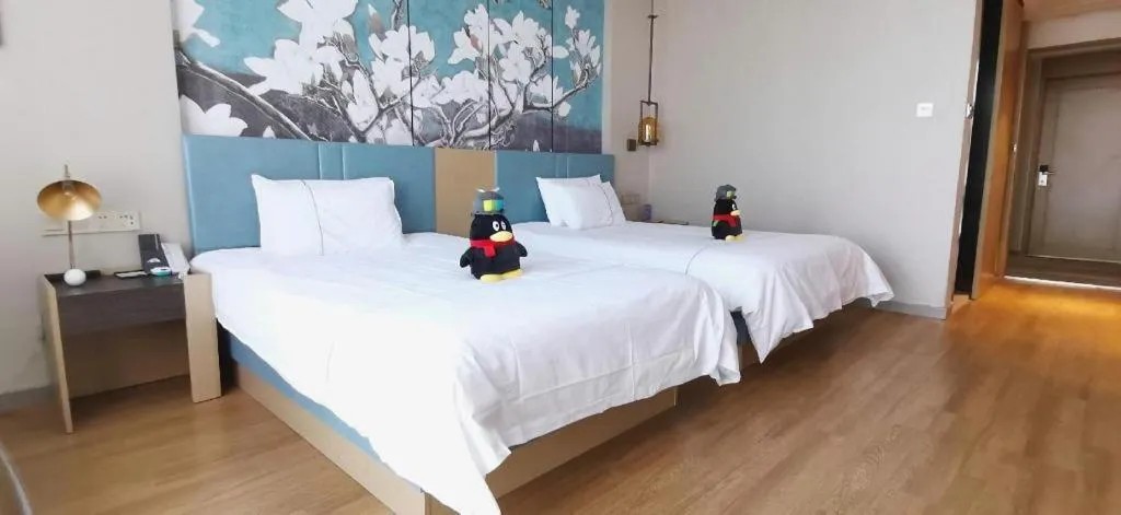 Bed in Magnotel Tongxiang Shimao Center