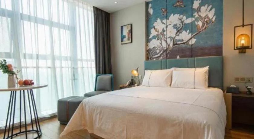 Bed in Magnotel Tongxiang Shimao Center