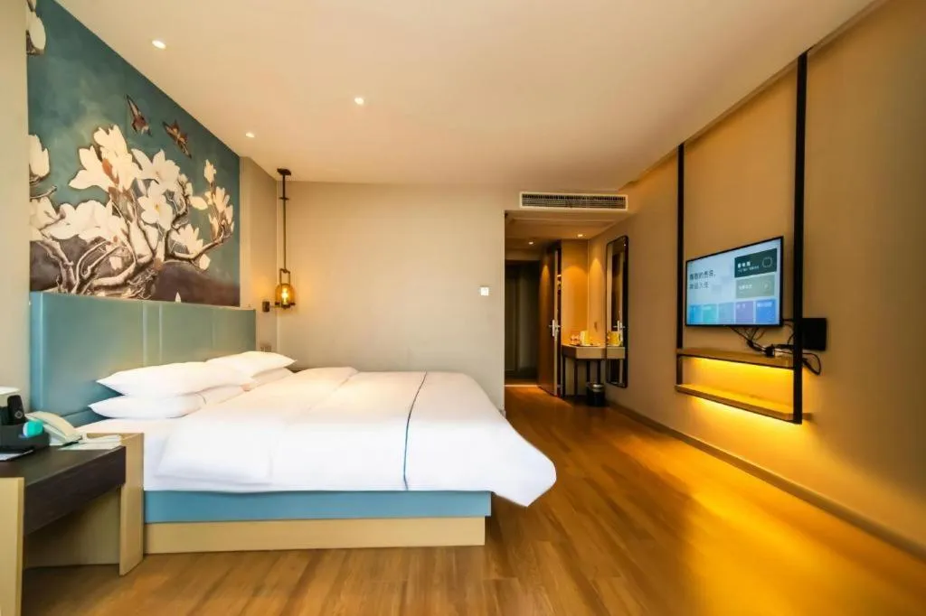 Bed in Magnotel Tongxiang Shimao Center