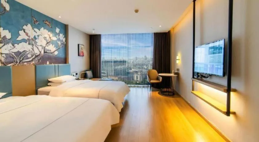 Bed in Magnotel Tongxiang Shimao Center