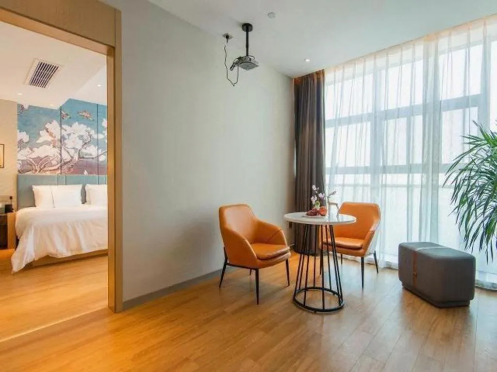 Bed in Magnotel Tongxiang Shimao Center