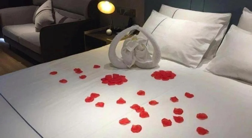 Bed in Magnotel Tongxiang Shimao Center