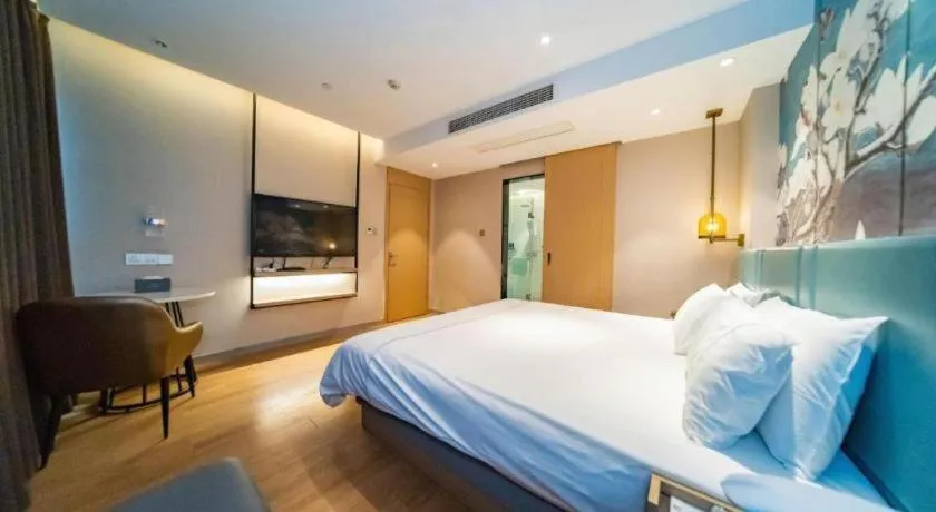 Bed in Magnotel Tongxiang Shimao Center