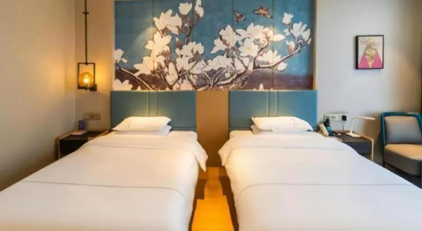 Bed in Magnotel Tongxiang Shimao Center