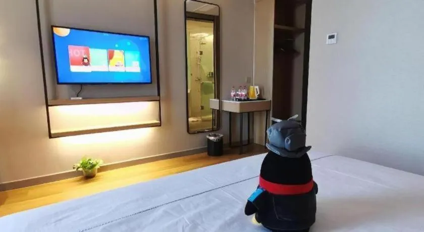 Bed in Magnotel Tongxiang Shimao Center