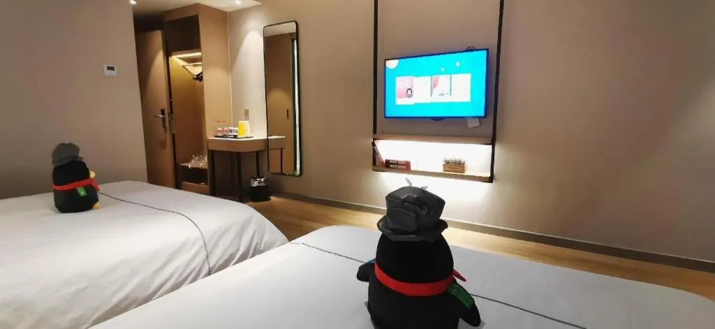 Bed in Magnotel Tongxiang Shimao Center