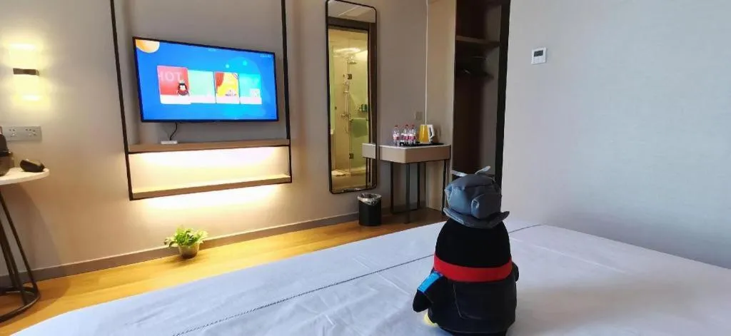 Bed in Magnotel Tongxiang Shimao Center