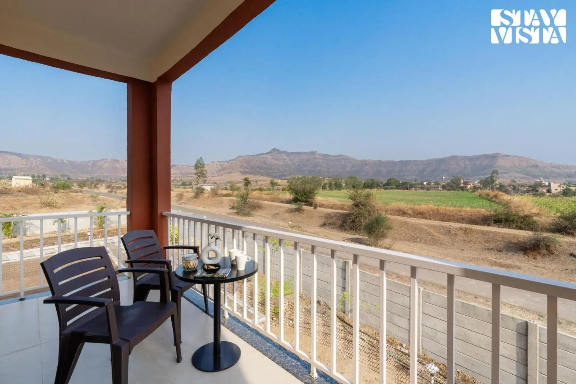 Balcony/Terrace in StayVista at Mangifera Agro Estate with Pool, Wi-Fi Balcony/Terrace in StayVista at Mangifera Agro Estate with Pool, Wi-Fi