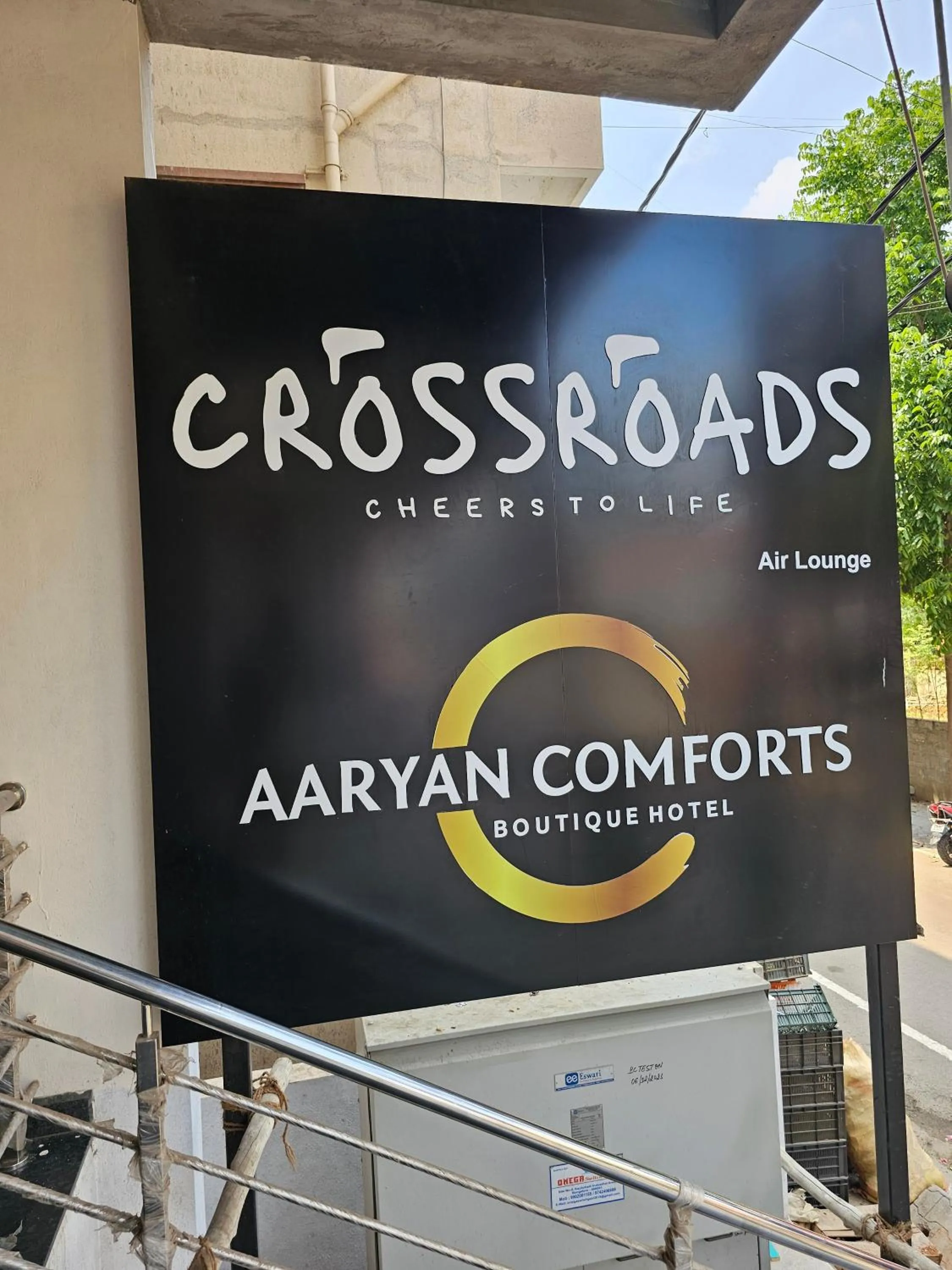 Property logo or sign in Hotel Aaryan Comforts - Peenya