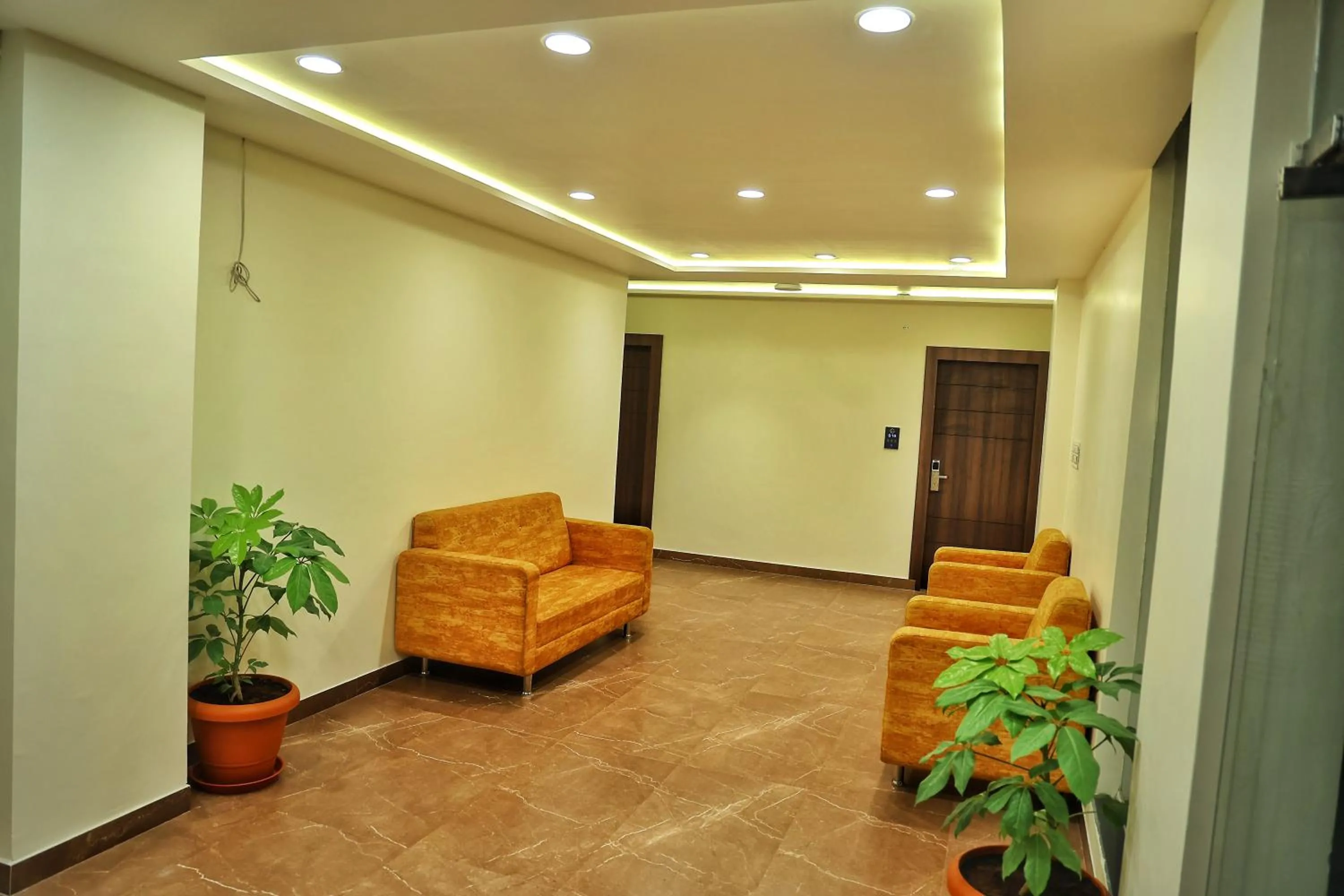 Seating area in Hotel Aaryan Comforts - Peenya