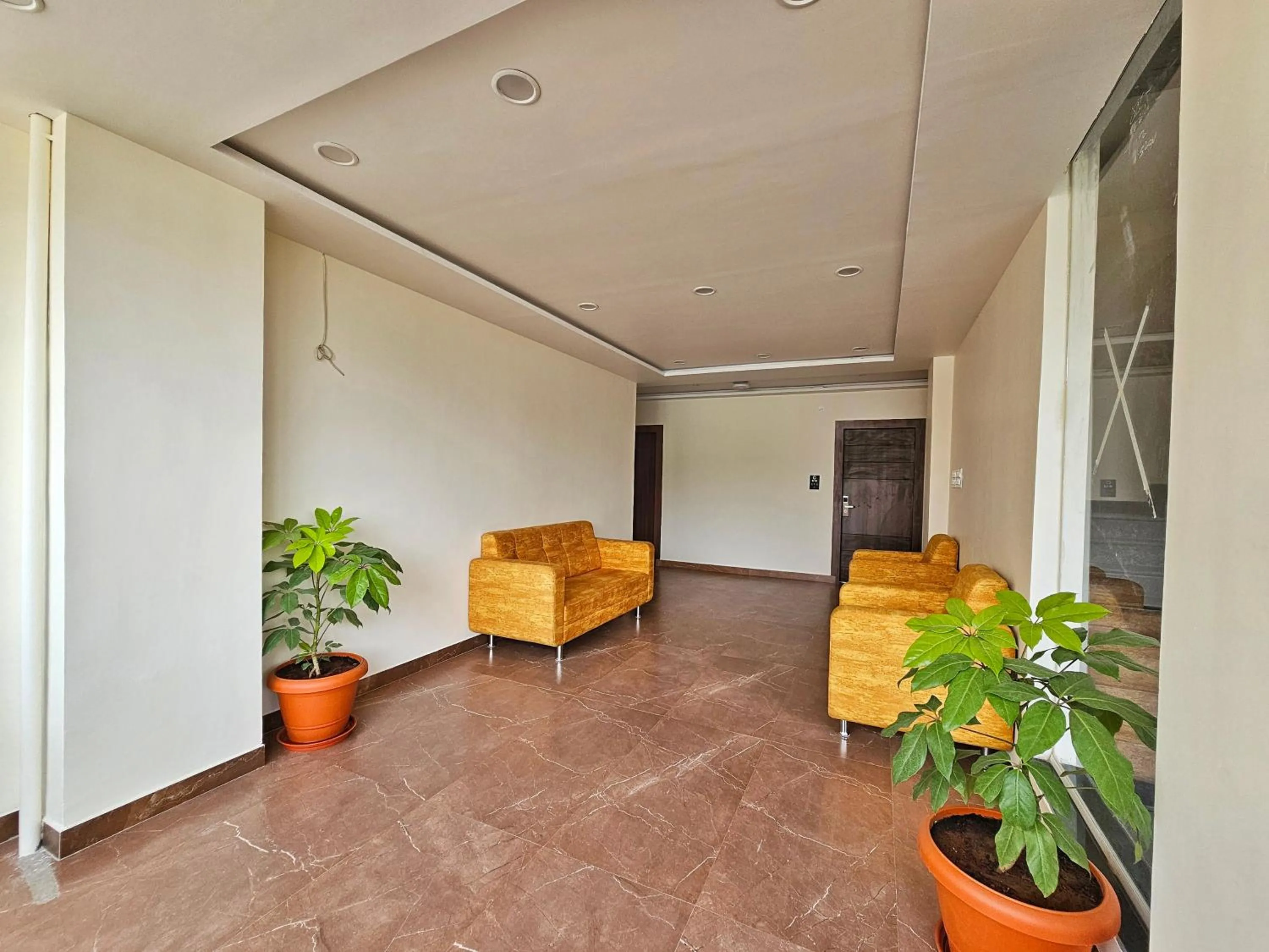 Seating area in Hotel Aaryan Comforts - Peenya