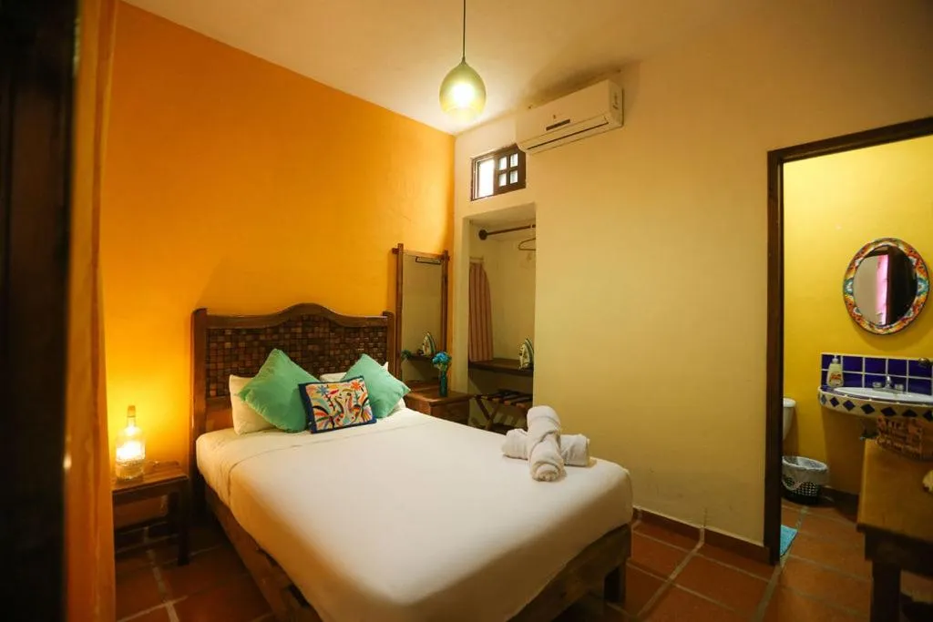 Bed in Íkaro Suites Colonial