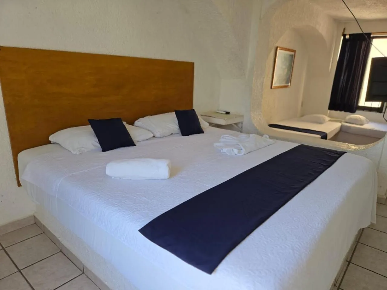 Bed in Íkaro Suites Cancún