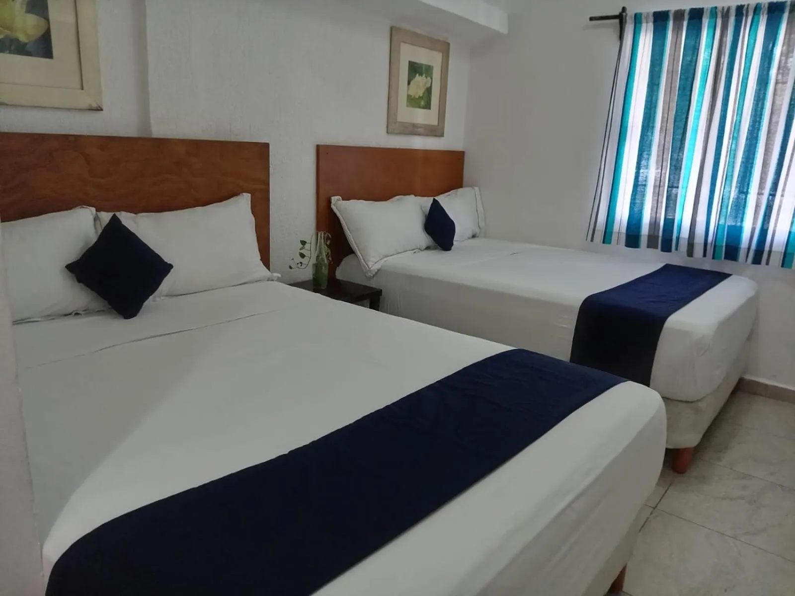 Bed in Íkaro Suites Cancún