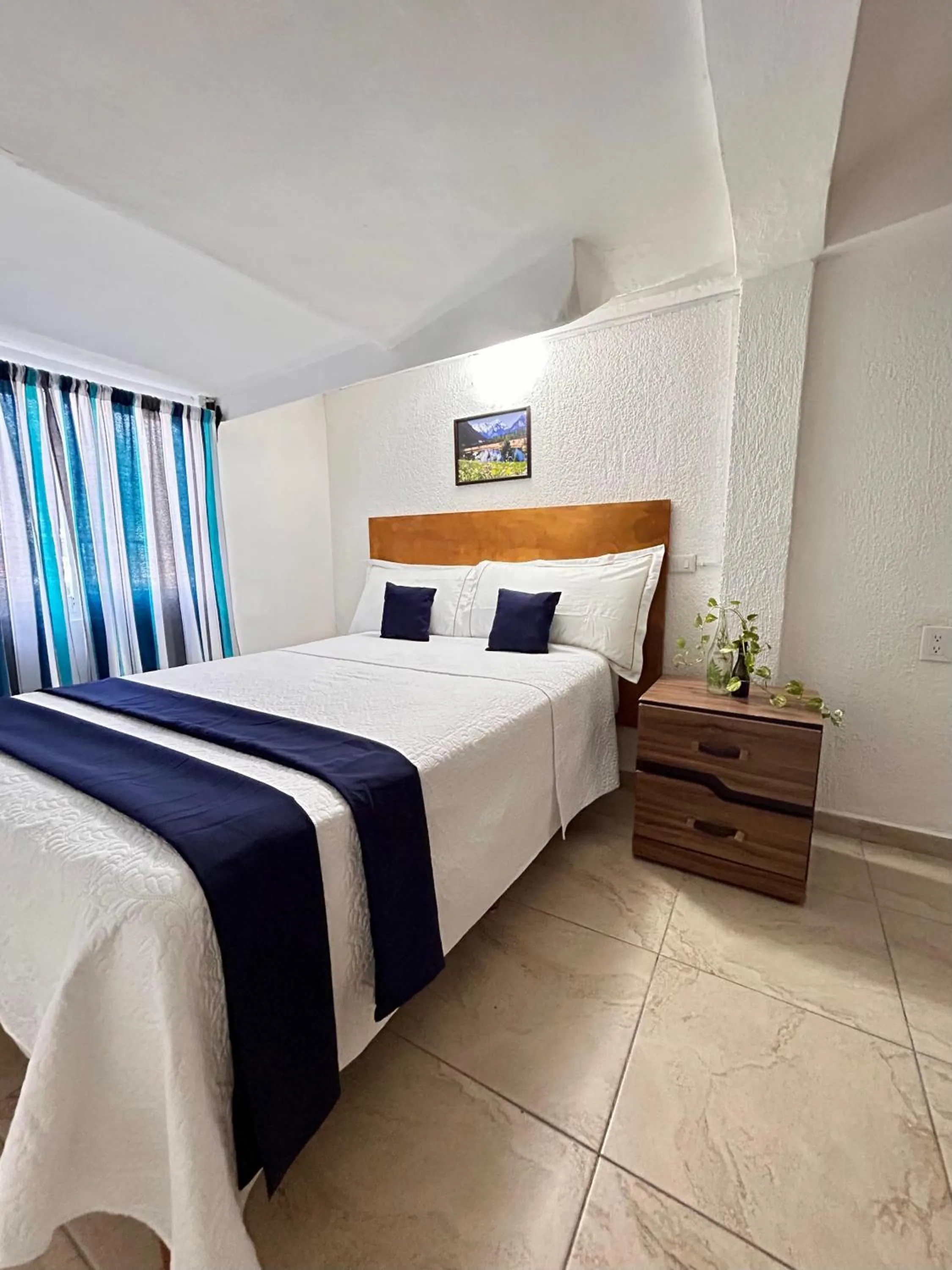 Bed in Íkaro Suites Cancún