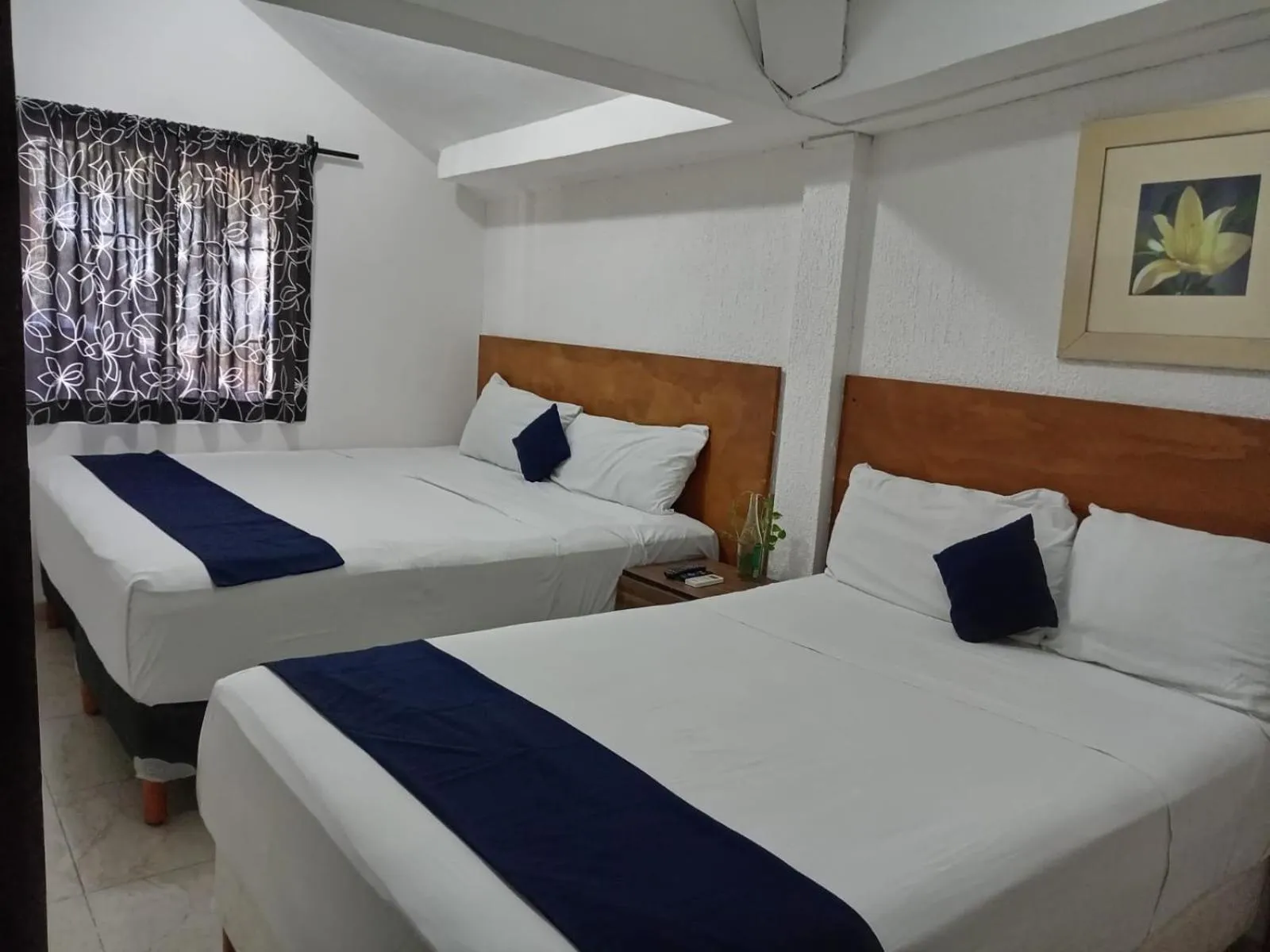 Bed in Íkaro Suites Cancún