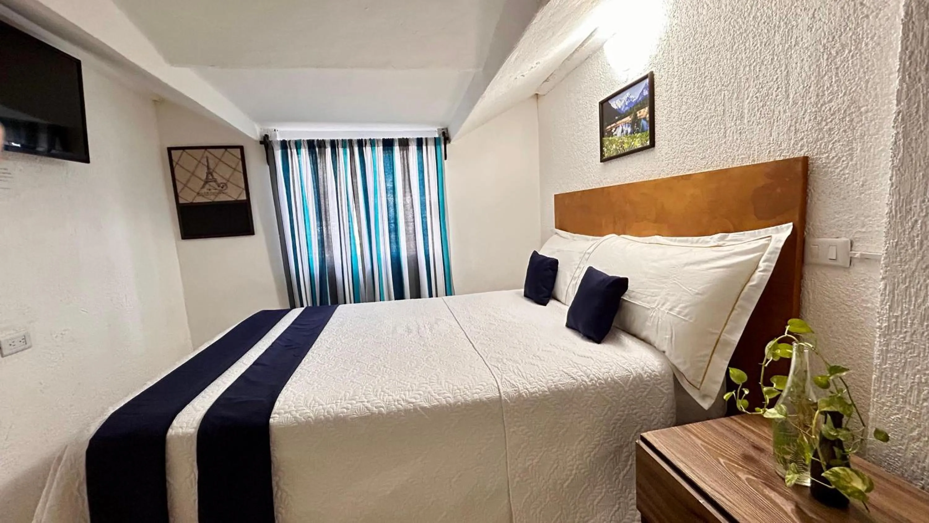 Bed in Íkaro Suites Cancún