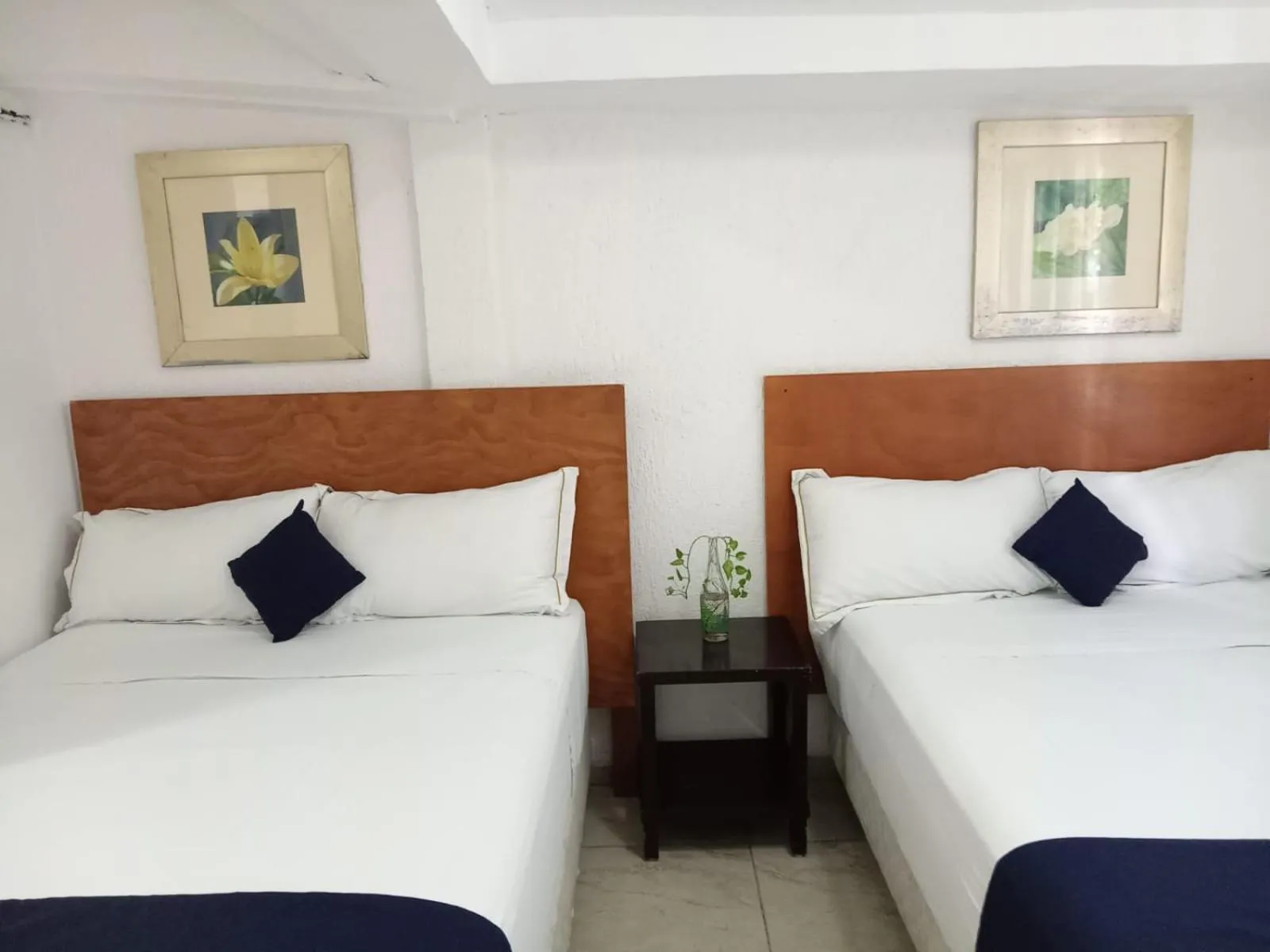 Bed in Íkaro Suites Cancún