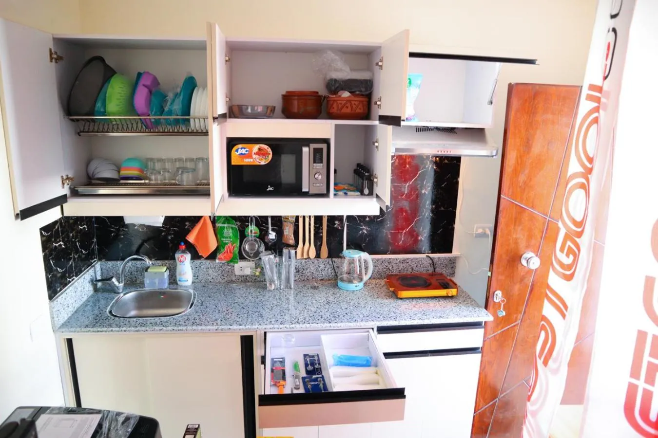 Kitchen or kitchenette in Hostgool Beach Chalets Mirage bay resort & aqua park