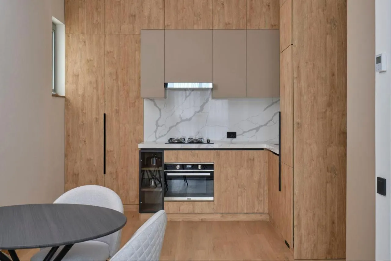 Kitchen or kitchenette in STYLO Residences & Suites